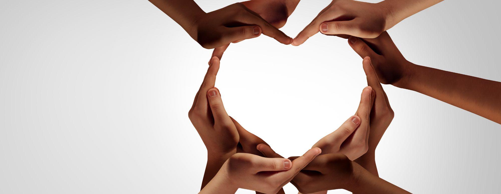 many hands forming a heart