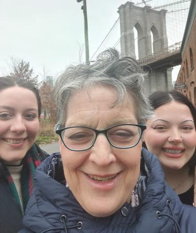 Christina lake with daughters in front of bridge